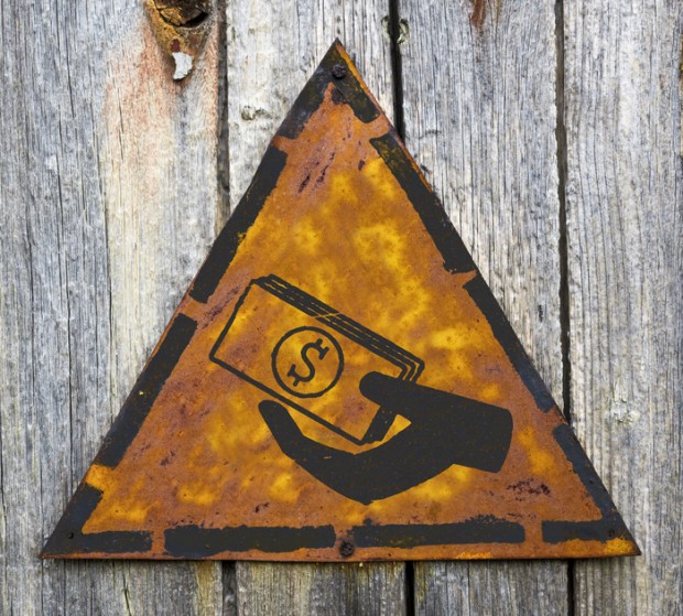 Icon of Money in the Hand on Rusty Warning Sign.